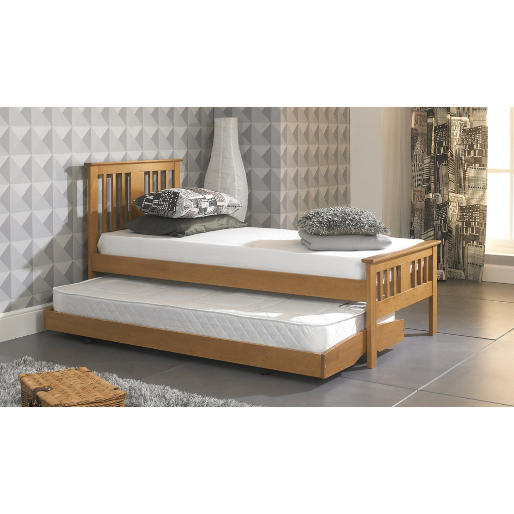 Bergen Solid Wood Guest Bed with Trundle in oak in furnished room