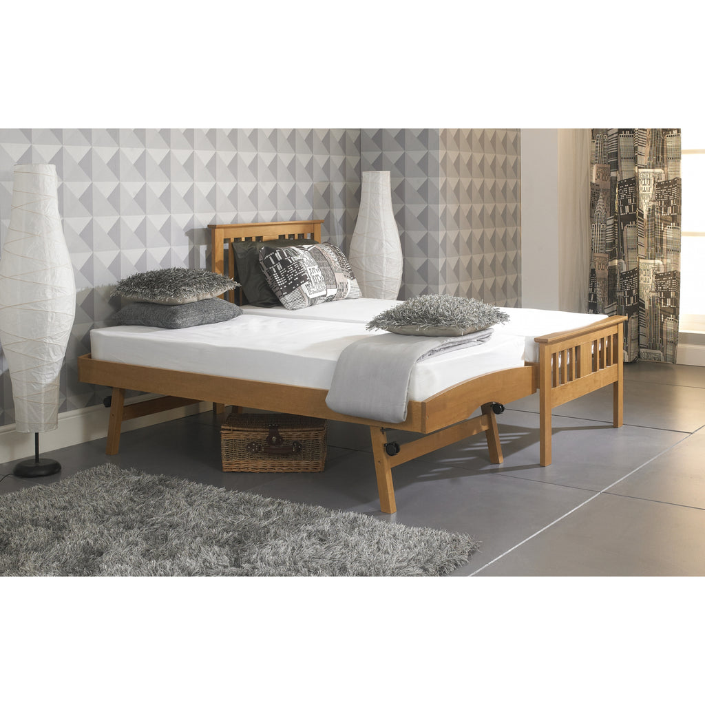 Bergen Solid Wood Guest Bed with Trundle in oak in furnished room, trundle set-up with a second mattress