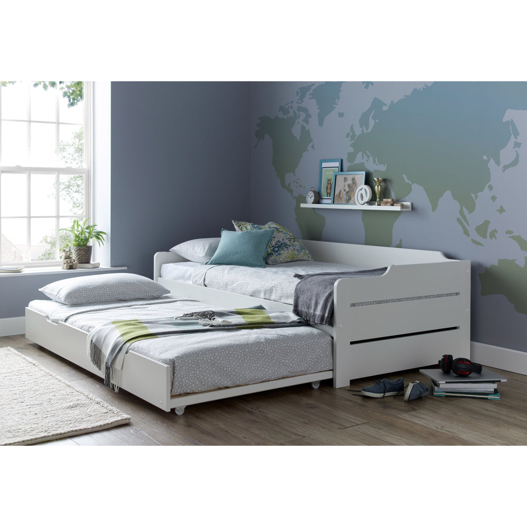 Copella Pine Guest Bed With Trundle, showing trundle in use and made up as a bed in a furnished room
