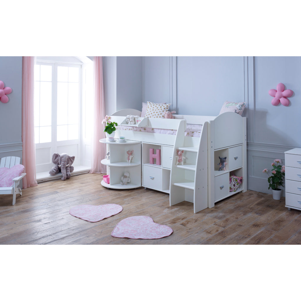 Eli Midsleeper with retracted Pullout Desk and two Cube Units in all white in a furnished bedroom.