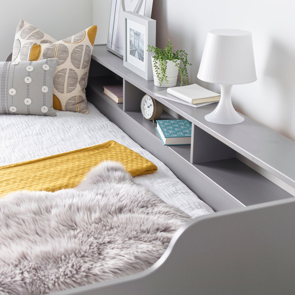 Tyler Pine Guest Bed With Trundle in grey. Shown in furnished room, shelving detail.