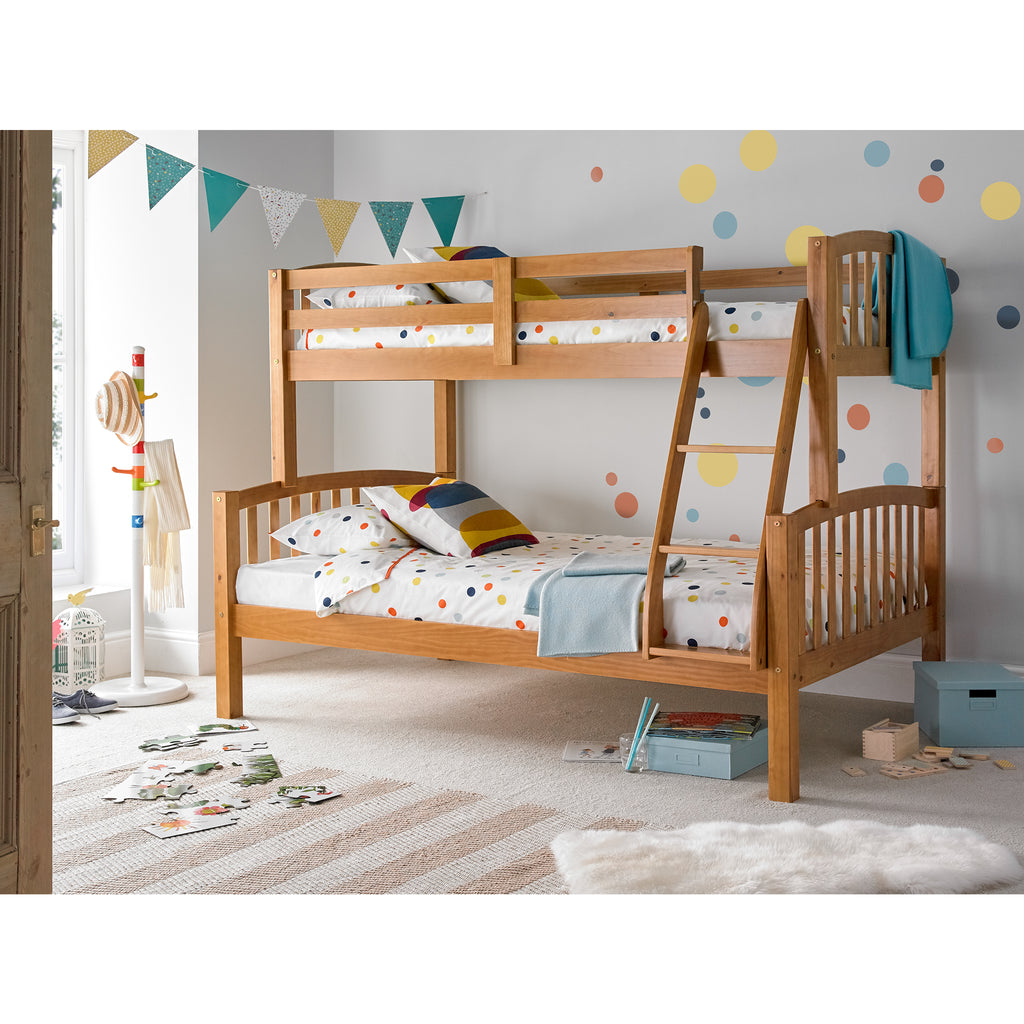 Mya Triple Sleeper in natural pine in furnished bedroom