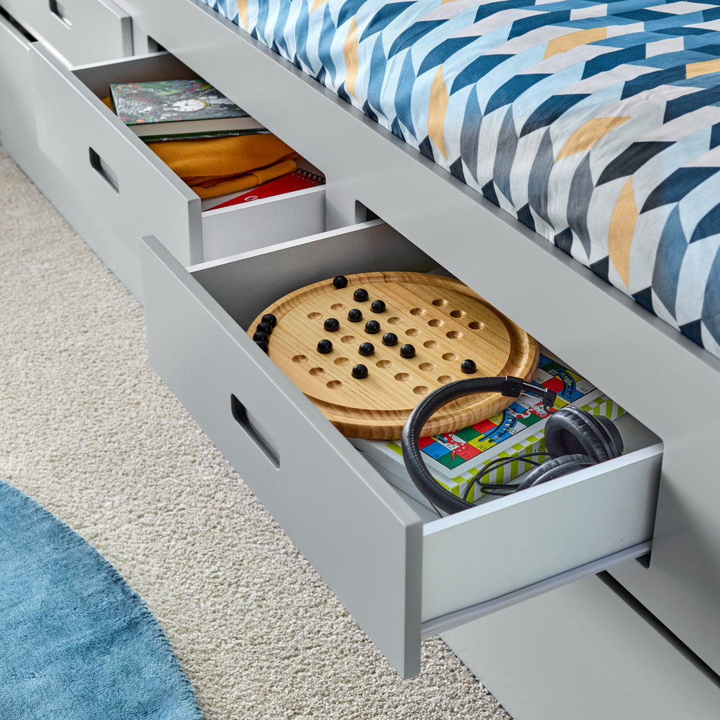 Veera Guest Bed & Trundle in grey in furnished room, drawers detail