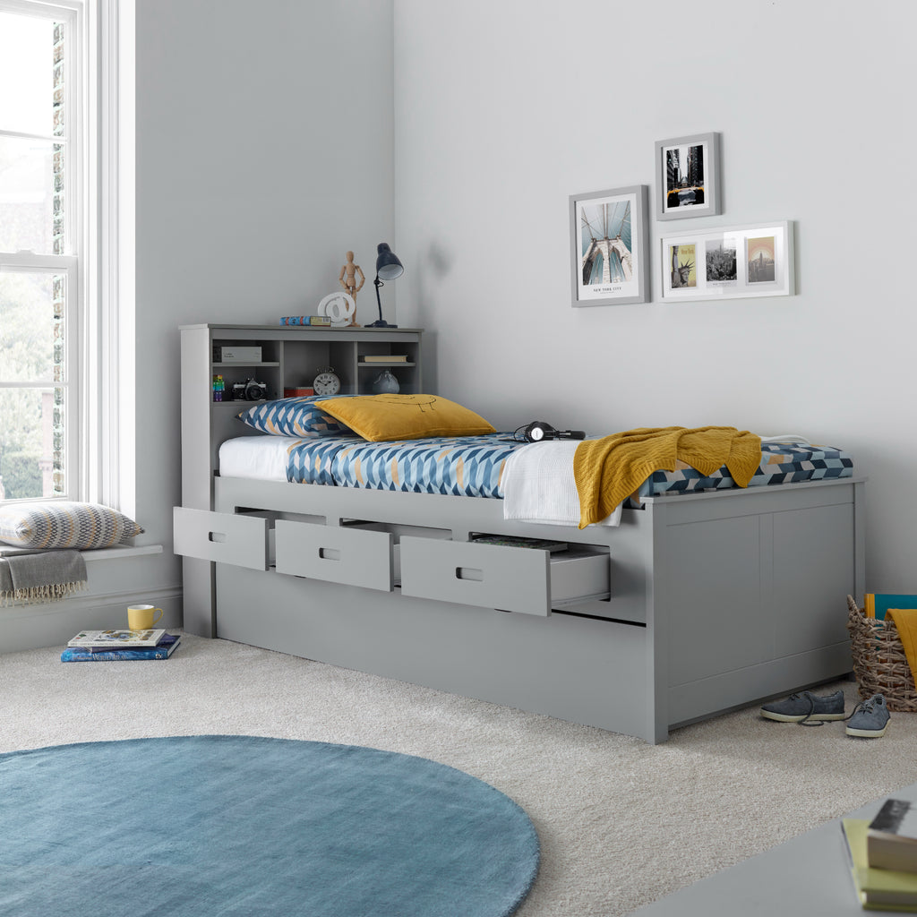 Veera Guest Bed & Trundle in grey in furnished room, trundle closed and drawers open