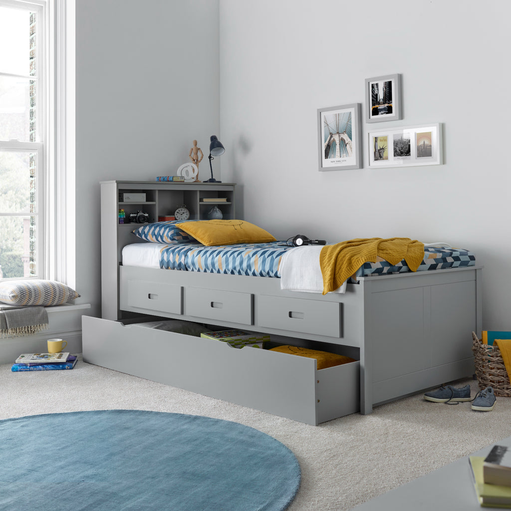 Veera Guest Bed & Trundle in grey in furnished room, trundle open and used for storage