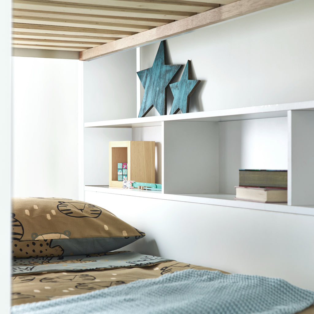 Oilver Solid Wood Bunk Bed in white in furnished room, lower bunk shelving detail