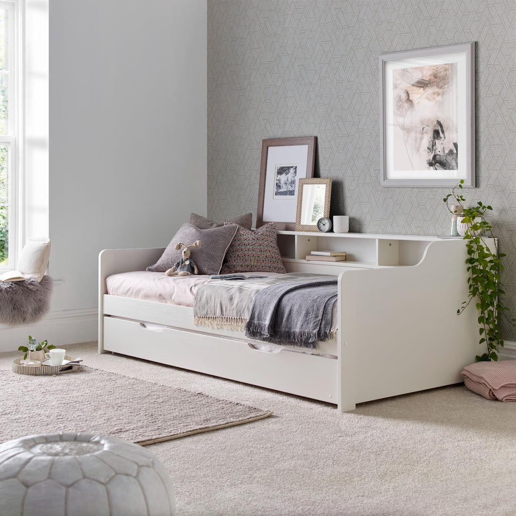 Tyler Pine Guest Bed With Trundle in white. Shown in furnished room with trundle closed.