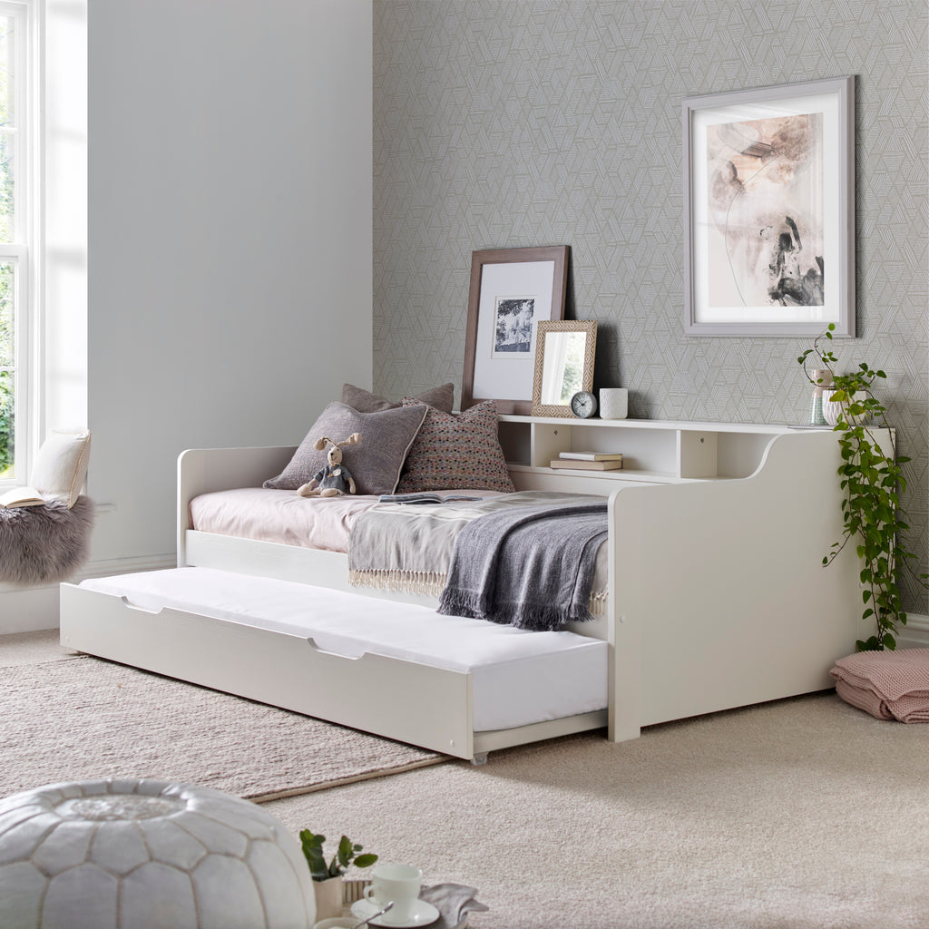 Tyler Pine Guest Bed With Trundle in white. Shown in furnished room with trundle open.